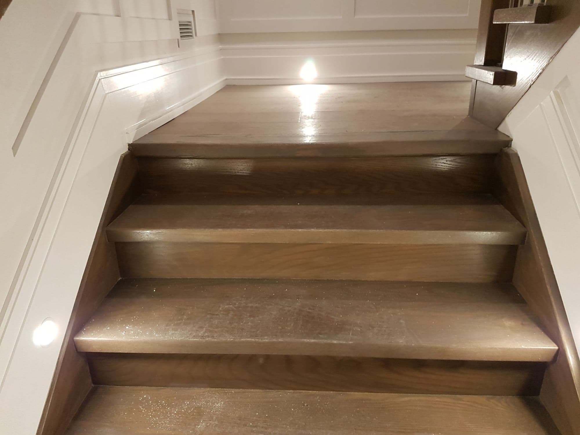 Timber stair treads with recessed lighting in the side wall