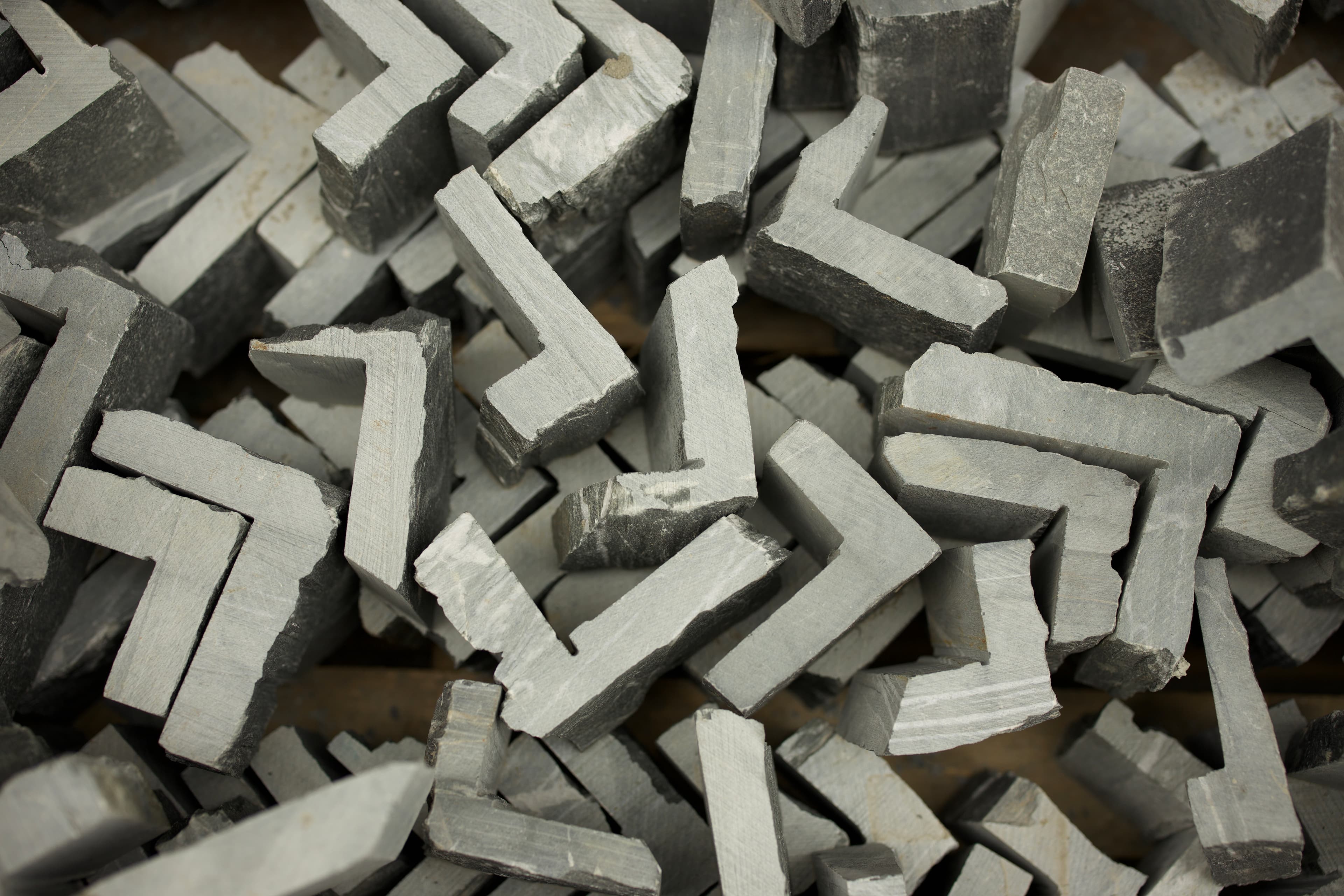 Stone corner pieces stacked in DWL's workshop